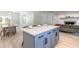 Kitchen island with seating is next to the dining area and living area with fireplace at 3626 Donna St, Port Orange, FL 32129