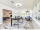 Bright living area with updated flooring and a black game table at 3626 Donna St, Port Orange, FL 32129
