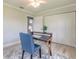 A home office featuring bright windows, a desk, and a ceiling fan at 3626 Donna St, Port Orange, FL 32129