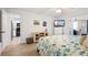 Bright bedroom features an ocean themed decor and a ceiling fan, as well as tile flooring at 4139 S Atlantic Ave # B508, New Smyrna Beach, FL 32169