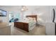 Comfortable bedroom featuring light hardwood floors, a full bed, and neutral décor at 4139 S Atlantic Ave # B508, New Smyrna Beach, FL 32169