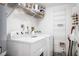 Well-equipped laundry room with shelving, washer and dryer, and room for storage at 4139 S Atlantic Ave # B508, New Smyrna Beach, FL 32169