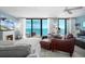 Bright living room featuring ocean views, fireplace, comfortable furnishings and tile flooring at 4139 S Atlantic Ave # B508, New Smyrna Beach, FL 32169
