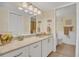 Well-lit bathroom with a spacious vanity, framed mirror, and convenient access to the toilet and shower at 4403 Sea Mist Dr # 109, New Smyrna Beach, FL 32169