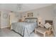 Comfortable bedroom features a ceiling fan, queen sized bed, and stylish beach decor at 4403 Sea Mist Dr # 109, New Smyrna Beach, FL 32169
