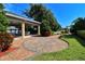 Beautifully landscaped community area with a covered patio and seating, perfect for outdoor gatherings and relaxation at 4403 Sea Mist Dr # 109, New Smyrna Beach, FL 32169