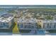 Aerial view of oceanfront condos with pool and beach access and nearby neighborhoods at 4555 S Atlantic Ave # 4405, Ponce Inlet, FL 32127