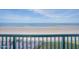 Relaxing ocean views from a private balcony with lounge chairs and a brick patio below at 4555 S Atlantic Ave # 4405, Ponce Inlet, FL 32127