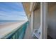 Enjoy ocean views from a private balcony with a chair in this beachside condo at 4555 S Atlantic Ave # 4405, Ponce Inlet, FL 32127