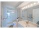 Bathroom featuring walk-in shower, toilet, and decorative wallpaper at 4555 S Atlantic Ave # 4405, Ponce Inlet, FL 32127