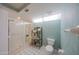 Bathroom features a walk-in shower, toilet, and decorative wallpaper at 4555 S Atlantic Ave # 4405, Ponce Inlet, FL 32127