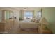 The main bedroom has a ceiling fan and a sliding glass door with ocean views and access to the balcony at 4555 S Atlantic Ave # 4405, Ponce Inlet, FL 32127