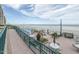 Beautiful beachfront pool and patio area with seating, umbrellas, and ocean views at 4555 S Atlantic Ave # 4405, Ponce Inlet, FL 32127