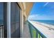 Condo balcony showcases stunning ocean views and overlooks a sandy beach on a sunny day at 4575 S Atlantic Ave # 6607, Ponce Inlet, FL 32127