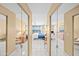 A luxurious main bedroom suite with mirrored closets and views of the ocean at 4575 S Atlantic Ave # 6607, Ponce Inlet, FL 32127
