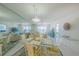 Bright dining area with ocean views featuring a glass dining table at 4575 S Atlantic Ave # 6607, Ponce Inlet, FL 32127