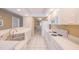 Galley style kitchen with white appliances, cabinetry and tile floor at 4575 S Atlantic Ave # 6607, Ponce Inlet, FL 32127