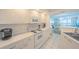 Bright kitchen with white appliances, ample counter space and ocean views at 4575 S Atlantic Ave # 6607, Ponce Inlet, FL 32127