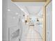 Long kitchen with white appliances and lots of natural light at 4575 S Atlantic Ave # 6607, Ponce Inlet, FL 32127