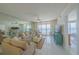 Bright living room with balcony access and serene ocean views at 4575 S Atlantic Ave # 6607, Ponce Inlet, FL 32127