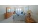Main bedroom featuring ocean views, tile floors, and wood furnishings at 4575 S Atlantic Ave # 6607, Ponce Inlet, FL 32127
