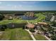 Aerial view of a golf community featuring beautiful homes, lakes, and lush green fairways at 461 Luna Bella Ln, New Smyrna Beach, FL 32168