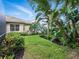 Beautifully landscaped backyard with lush greenery, providing a serene and private outdoor space at 461 Luna Bella Ln, New Smyrna Beach, FL 32168