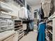 Well-organized walk-in closet with ample shelving and hanging space for clothes and accessories at 461 Luna Bella Ln, New Smyrna Beach, FL 32168