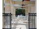 Covered patio area with comfortable seating, perfect for outdoor dining and entertaining at 461 Luna Bella Ln, New Smyrna Beach, FL 32168