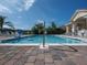 Community pool on a sunny day, offering a refreshing recreational amenity at 461 Luna Bella Ln, New Smyrna Beach, FL 32168