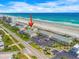 Aerial view of beach condos with pools in proximity to the beach and local roadways at 4777 S Atlantic Ave # B2, Port Orange, FL 32127