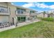 View of the condo complex's patios, green lawn, and ocean views at 4777 S Atlantic Ave # B2, Port Orange, FL 32127