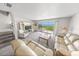 Spacious living room with sliding door access to outdoor patio and ocean view at 4777 S Atlantic Ave # B2, Port Orange, FL 32127