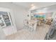 Bright living room and dining area with ocean views, adjacent to the in-unit laundry and a breakfast bar at 4777 S Atlantic Ave # B2, Port Orange, FL 32127
