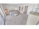 Bright main bedroom with a coastal theme, featuring a neutral color scheme and balcony access at 4777 S Atlantic Ave # B2, Port Orange, FL 32127