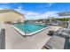 Community pool with ocean view featuring lounge chairs and sun umbrellas at 4777 S Atlantic Ave # B2, Port Orange, FL 32127