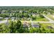 An aerial view of a home with a pool in a well-maintained residential neighborhood at 505 Sandale Ct, Deland, FL 32724
