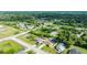 A high angle shot of the home, situated among beautiful green spaces and residential streets at 505 Sandale Ct, Deland, FL 32724