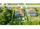 An aerial view showcasing a private screened-in pool and fenced yard at 505 Sandale Ct, Deland, FL 32724