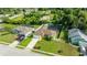 An aerial view of a beautiful home featuring a screened-in pool and lush green lawn at 505 Sandale Ct, Deland, FL 32724