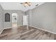 A primary bedroom features hardwood floors and an ensuite bathroom with a glass-enclosed shower at 505 Sandale Ct, Deland, FL 32724