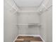 Empty closet with wire shelving, wood-look floors, and neutral paint at 505 Sandale Ct, Deland, FL 32724