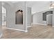 Open-concept living room with light gray walls, modern flooring, and a decorative niche adding character at 505 Sandale Ct, Deland, FL 32724