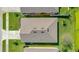 Aerial view of home showcasing roof condition, surrounding greenery, and neighborhood at 518 Safe Harbor Dr, Edgewater, FL 32141