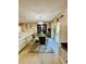 Elegant dining room with table, display cabinet, and sliding glass doors to the backyard at 520 Aeolian Dr, New Smyrna Beach, FL 32168