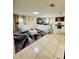 Bright living room with tile flooring, white sofas, and modern décor at 520 Aeolian Dr, New Smyrna Beach, FL 32168