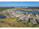 An aerial view of the property showcases a pool and the tranquil lake views in the Hawks Preserve community at 5263 Bear Corn Run, Port Orange, FL 32128