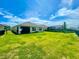 Spacious backyard with lush lawn, ideal for outdoor activities and entertaining guests with a view of the home at 5263 Bear Corn Run, Port Orange, FL 32128