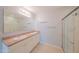 Bright bathroom showcases a double sink vanity with modern lighting and a glass shower at 5263 Bear Corn Run, Port Orange, FL 32128