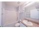 Clean bathroom with a tub, toilet, vanity with sink and a large mirror at 5263 Bear Corn Run, Port Orange, FL 32128